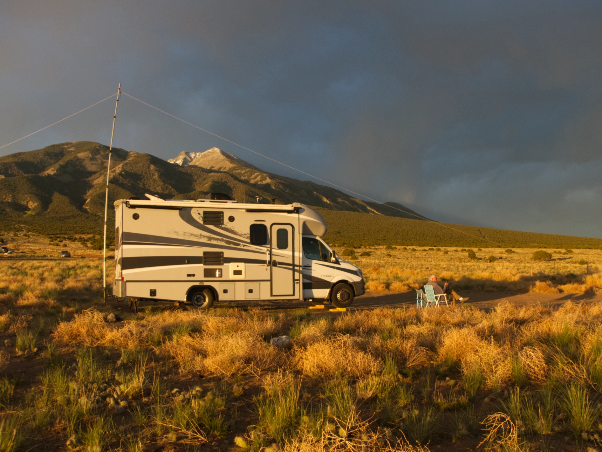 RV at sunset with ham radio antenna