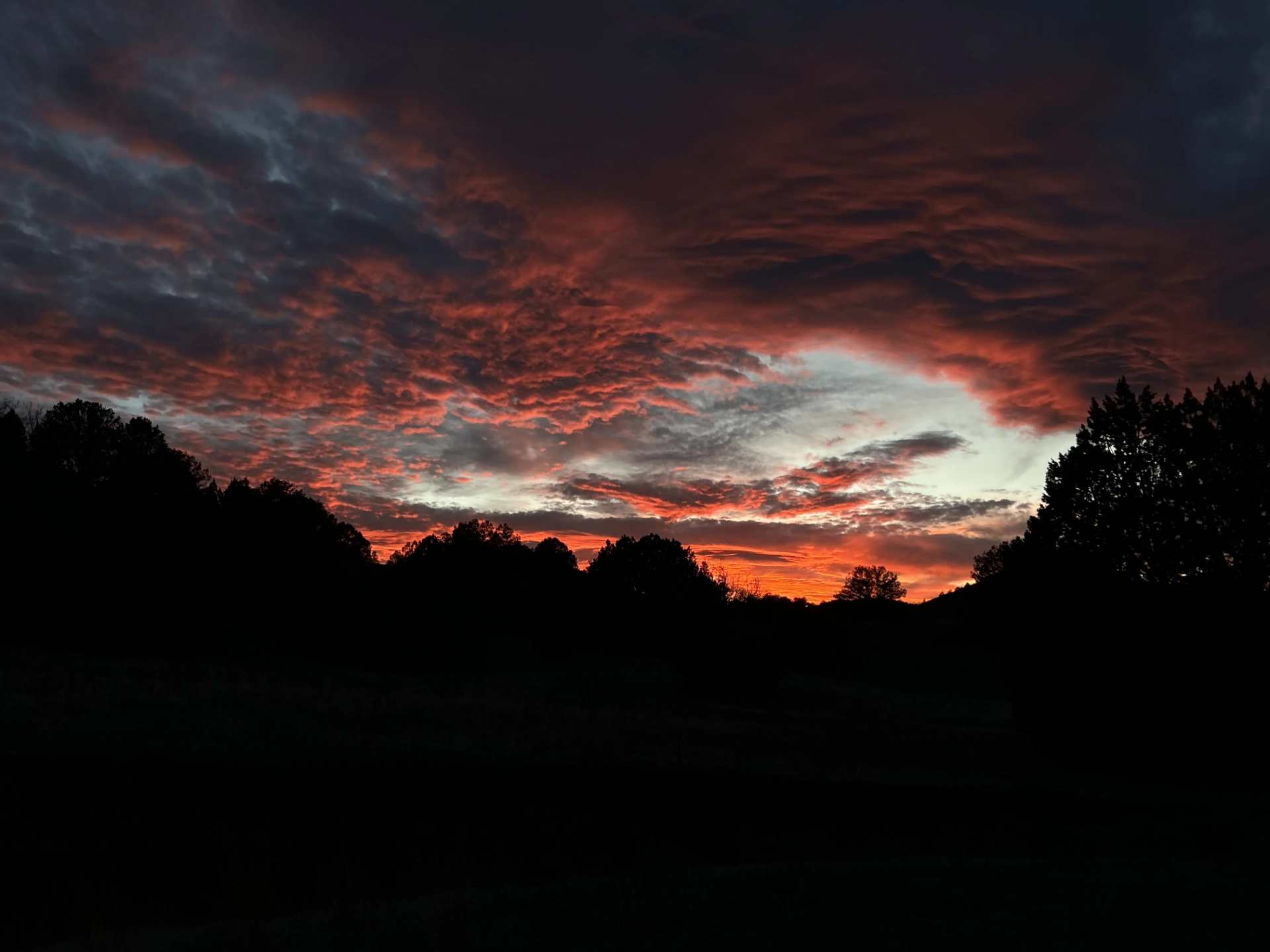 deep crimson and slate blue sky