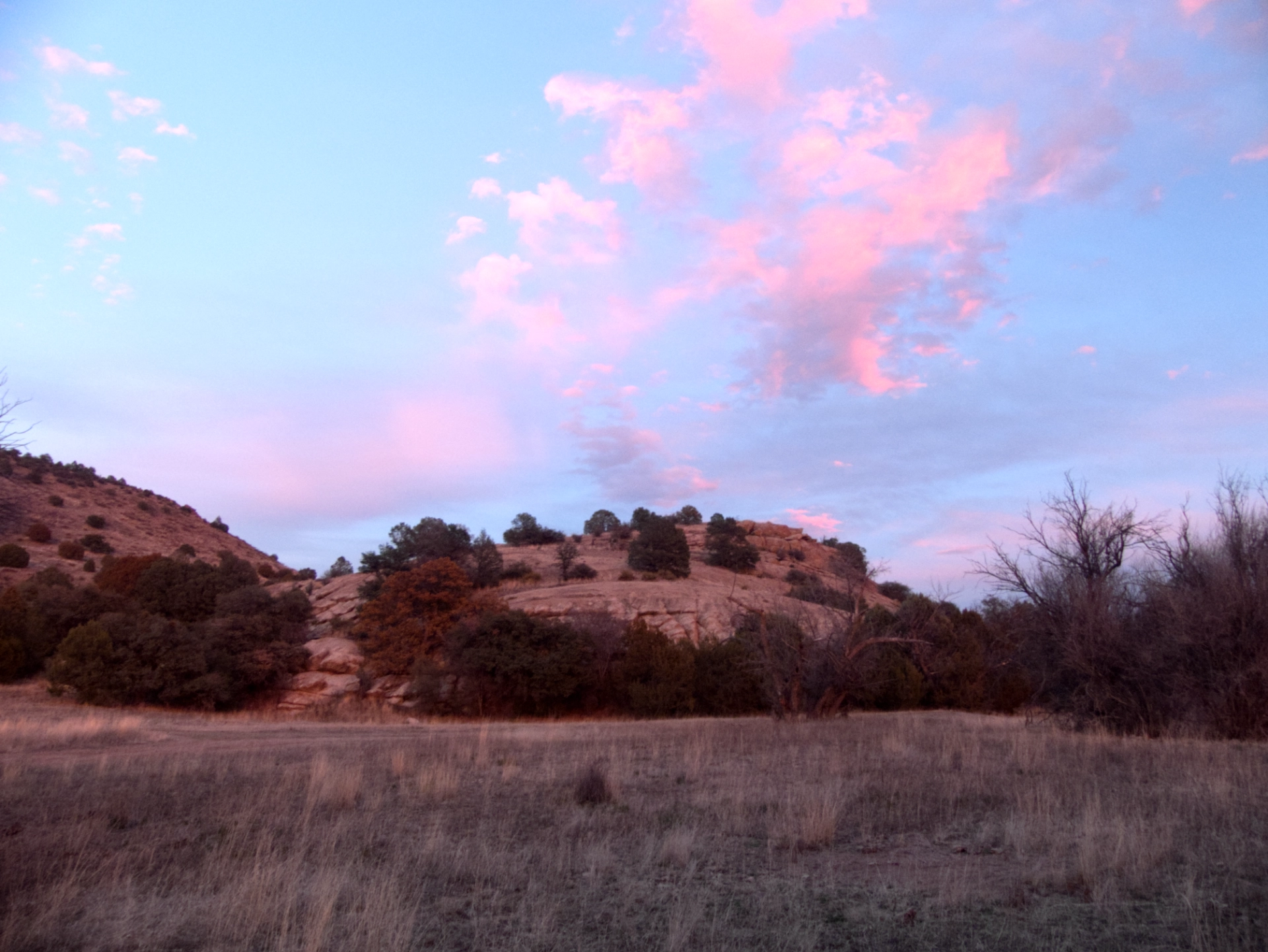 rosy post-sunset glow on nearby hills
