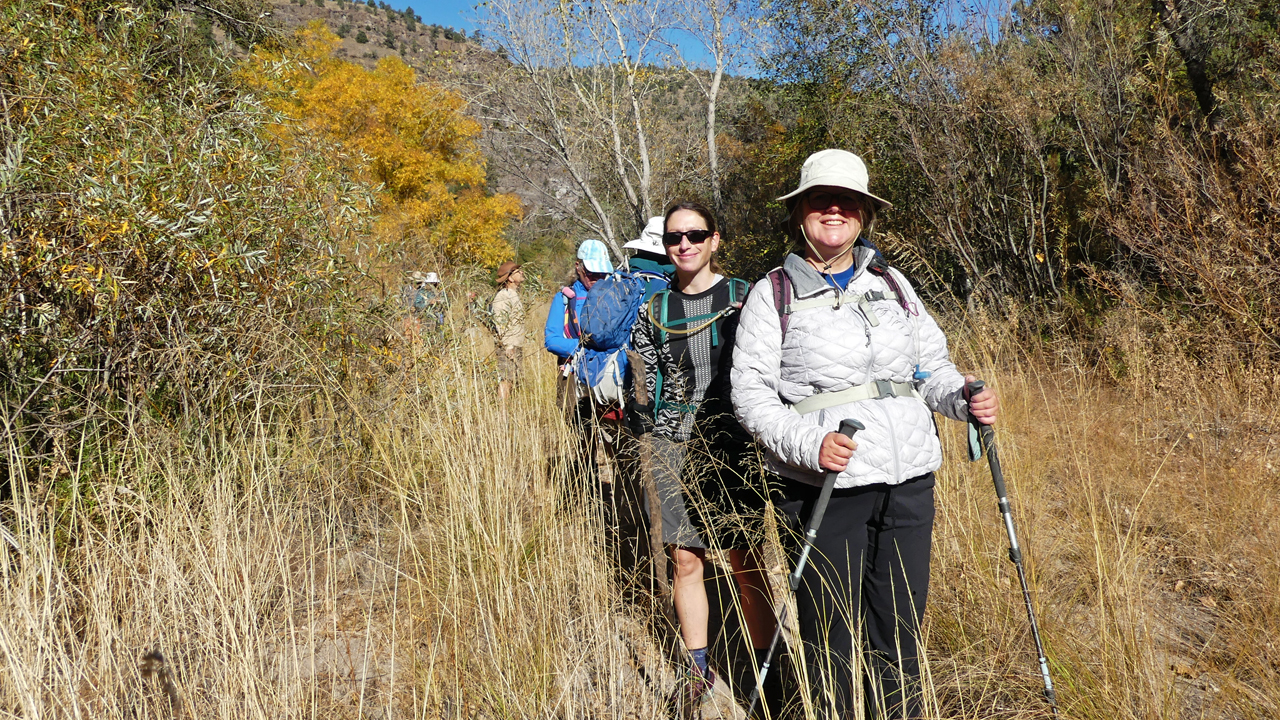 group hiking in canyon - front