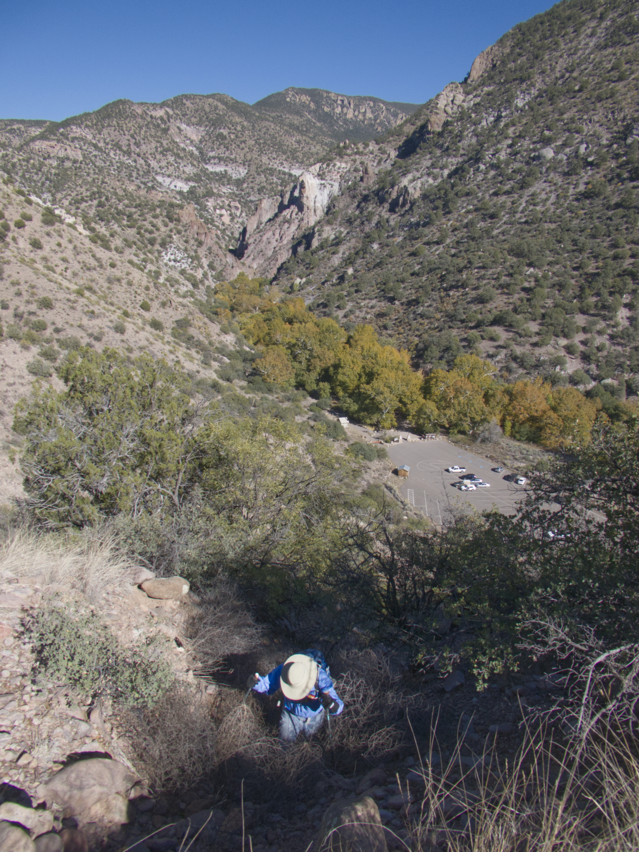 Dennis climbing up a very steep cliff