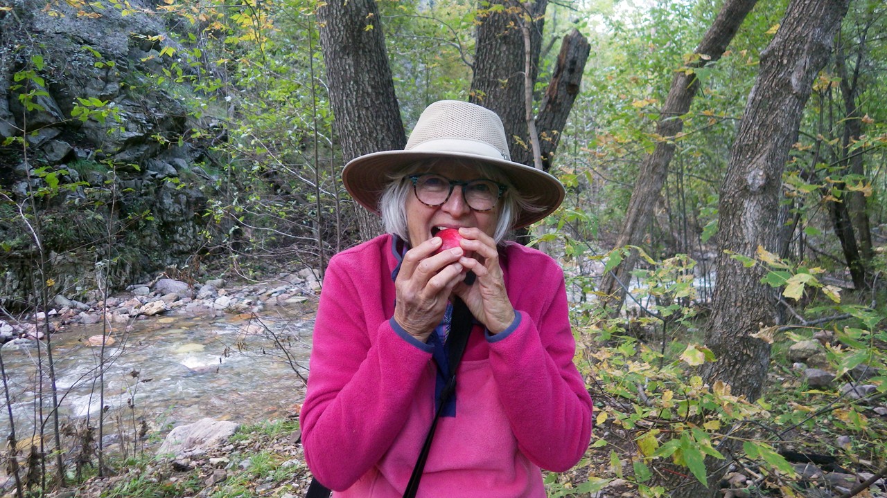 Marion sampling an apple