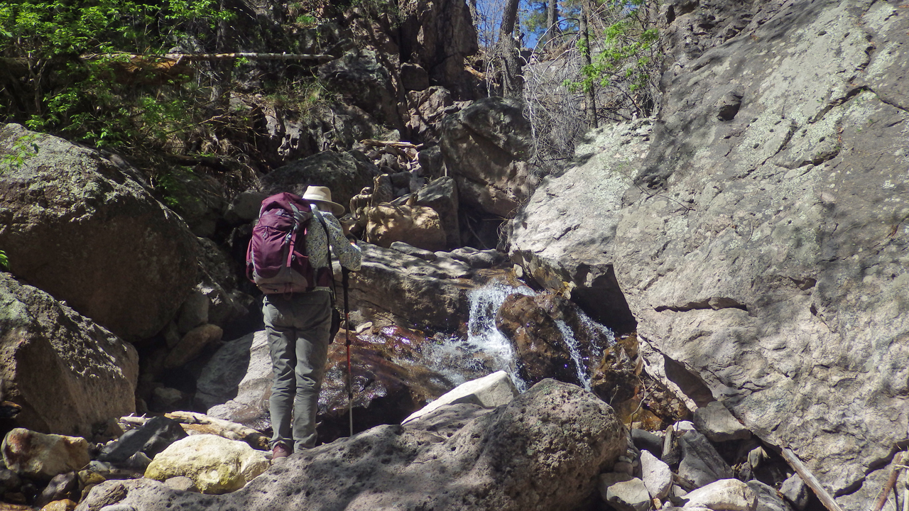 Marion climbing over rocks