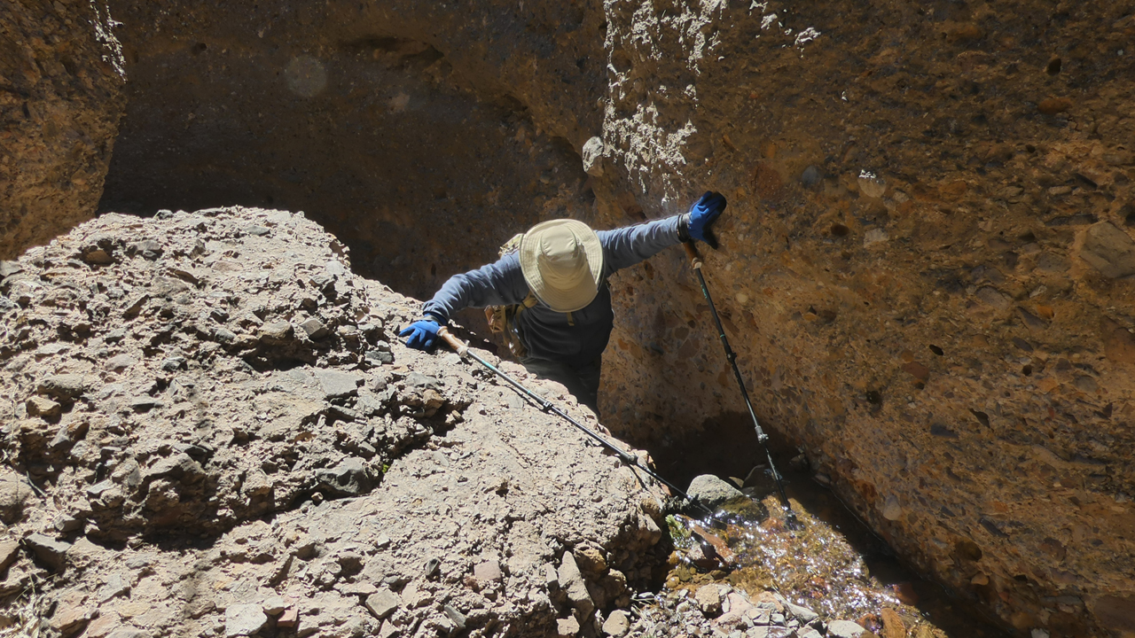 climbing around a small waterfall