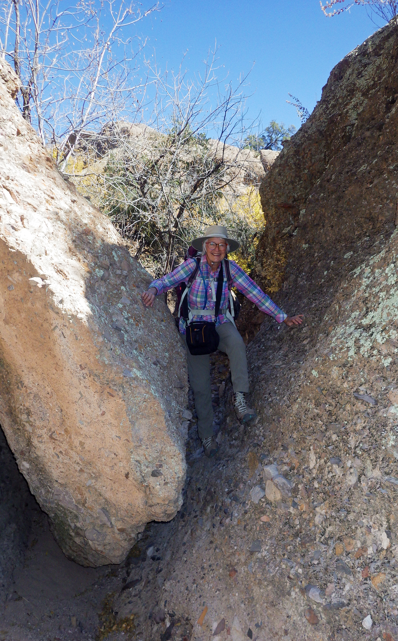 climbing over a boulder at the canyon mouth