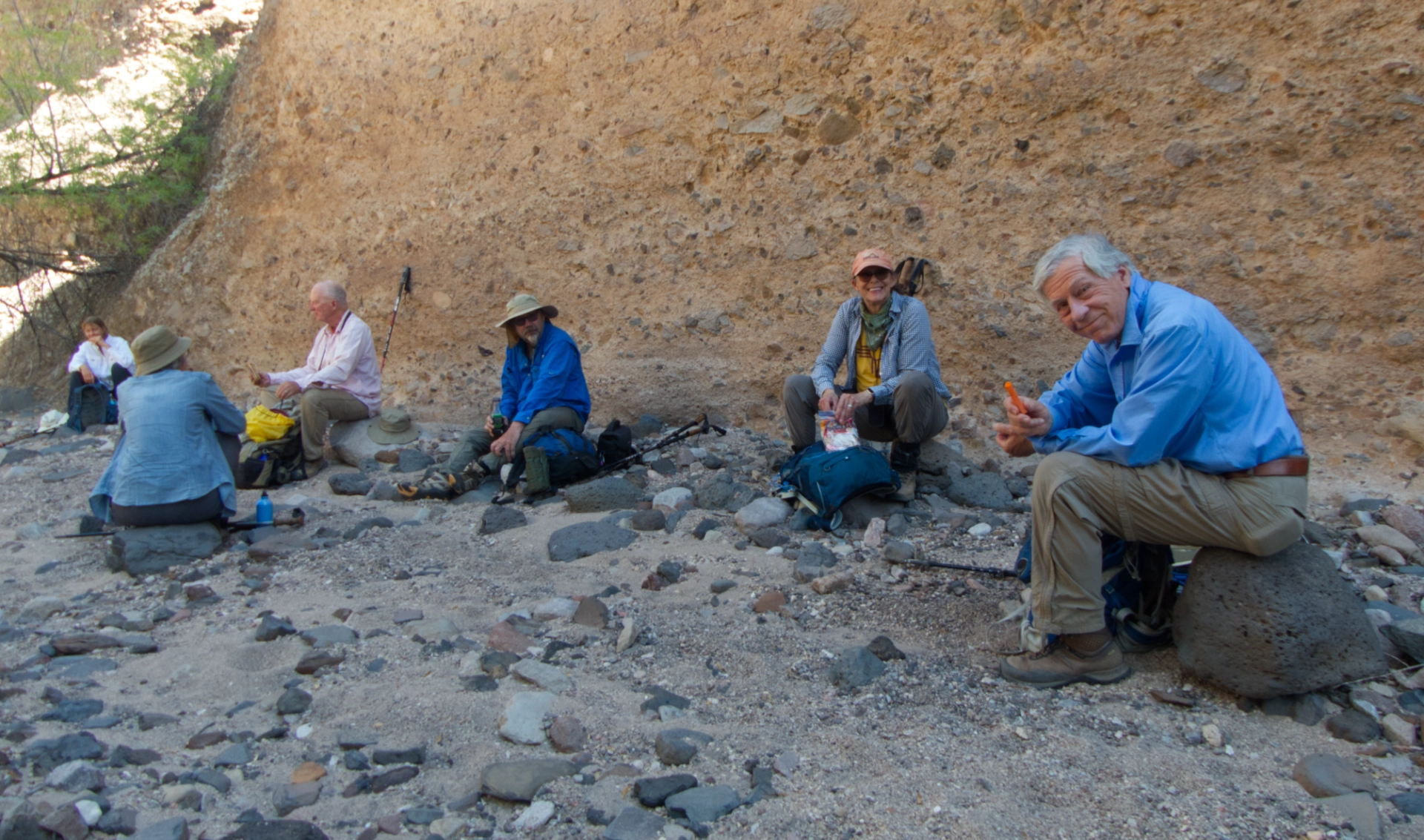 hikers having lunch in the shade