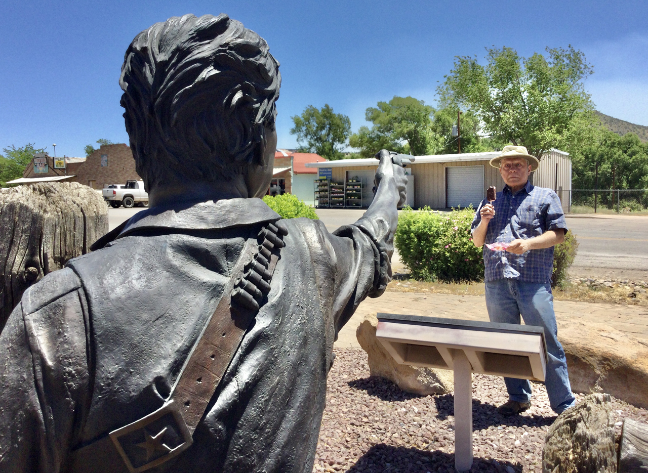 Dennis with statue of Elfego Baca