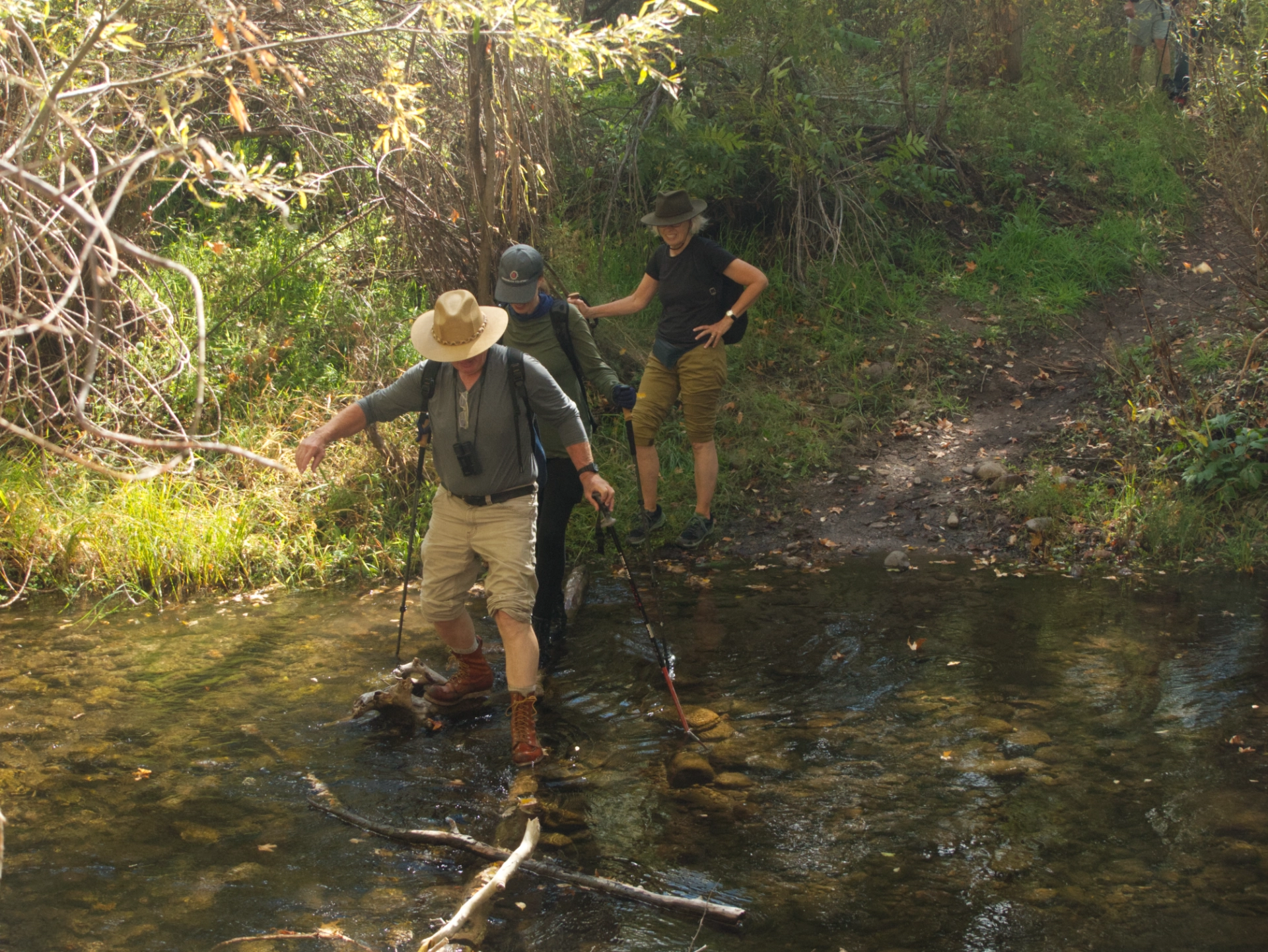 hikers crossing the creek