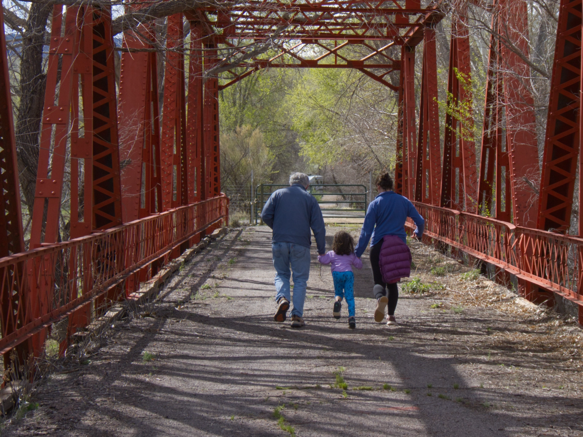 Dennis, CC and Jamie running across the bridge