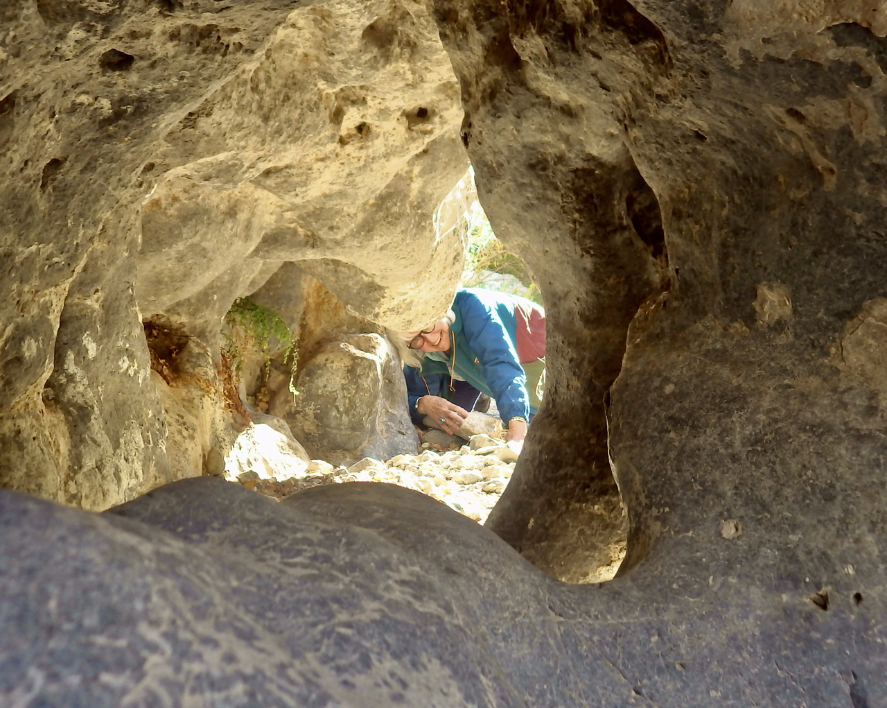 peering through a tunnel in the rock