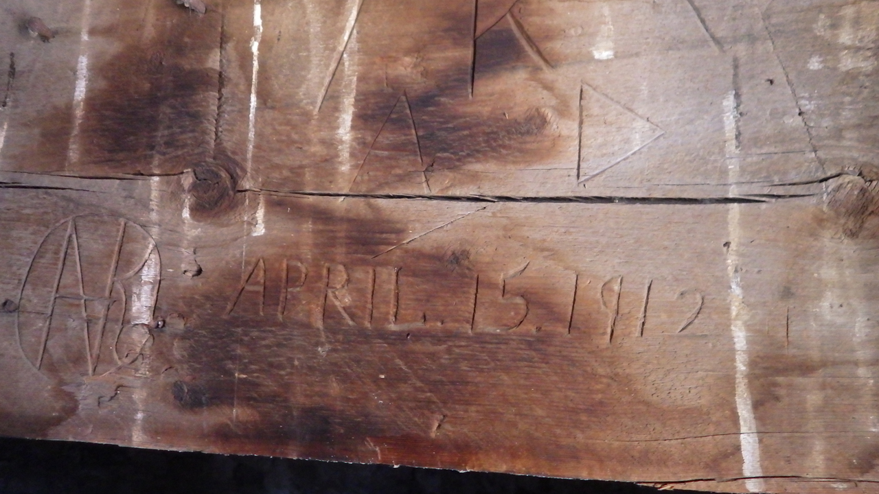 1912 graffit on spring house roof