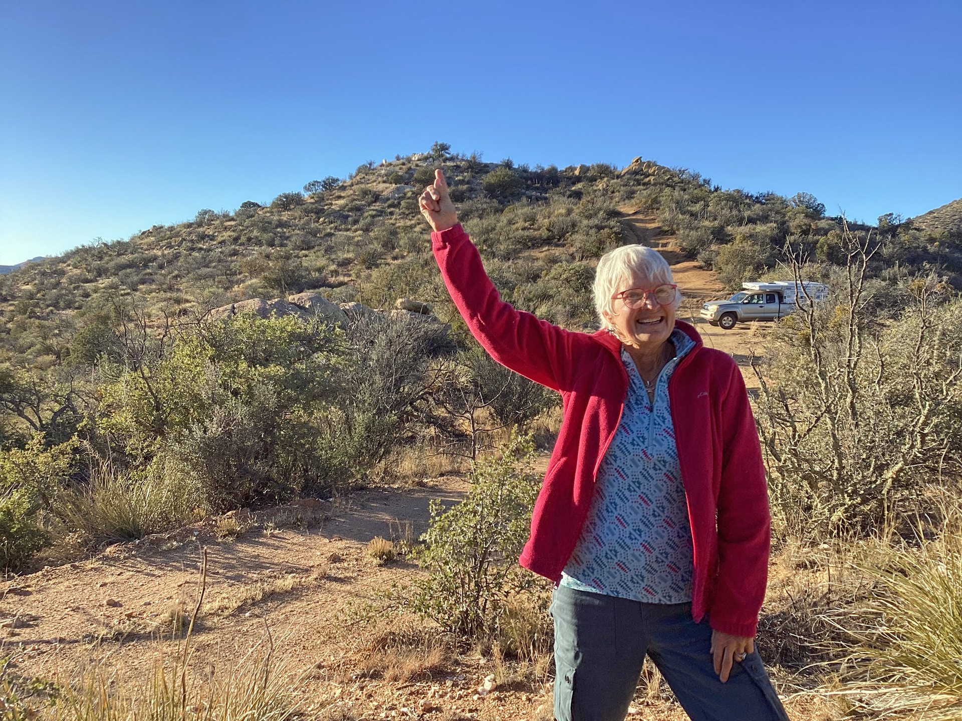 pointing to the summit at the end of a long hike