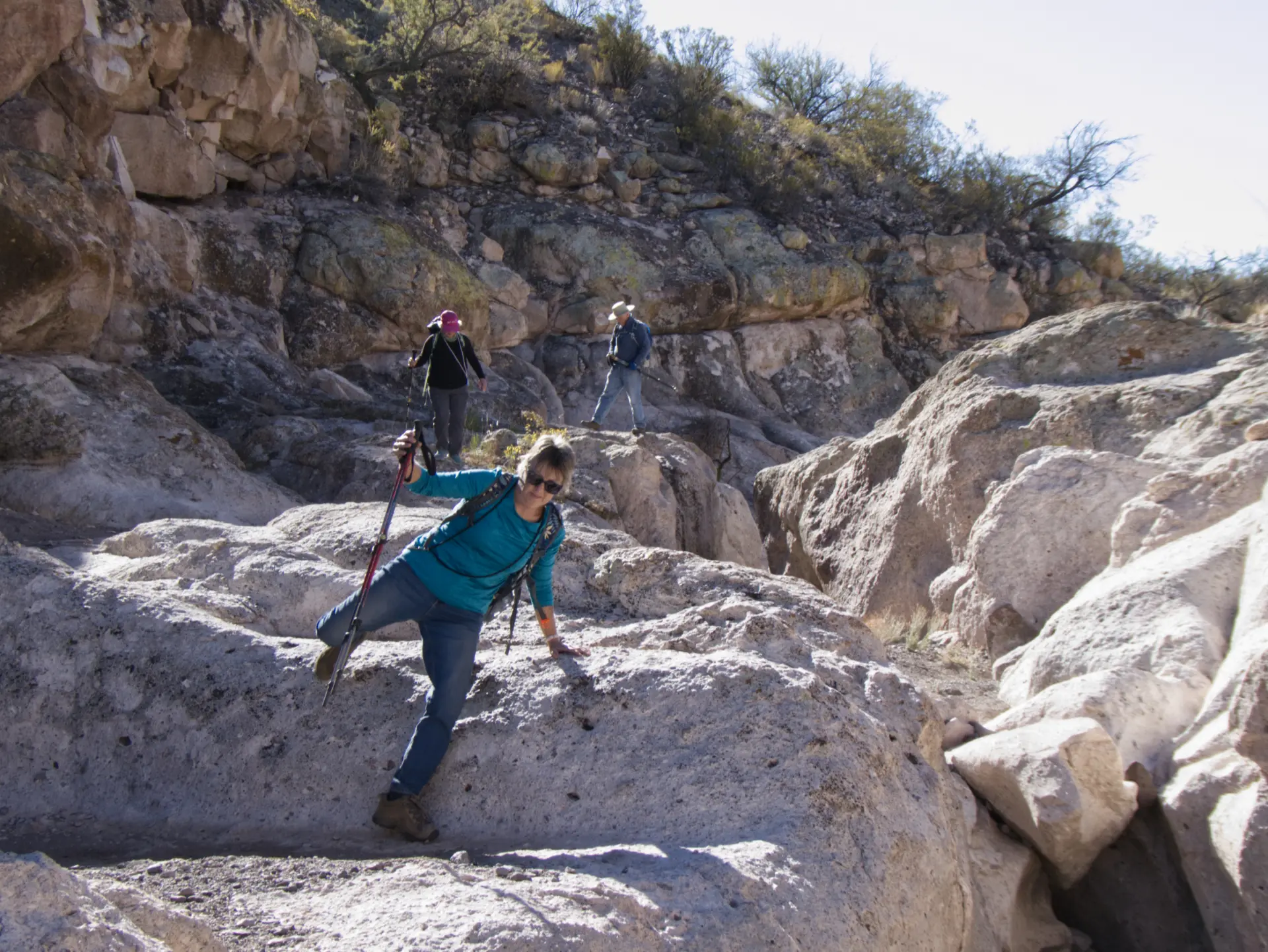 Jane hopping over the rocks