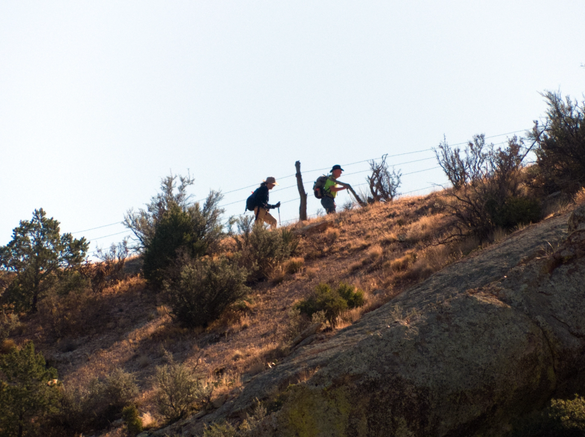 close-up of hikers on a distant slope