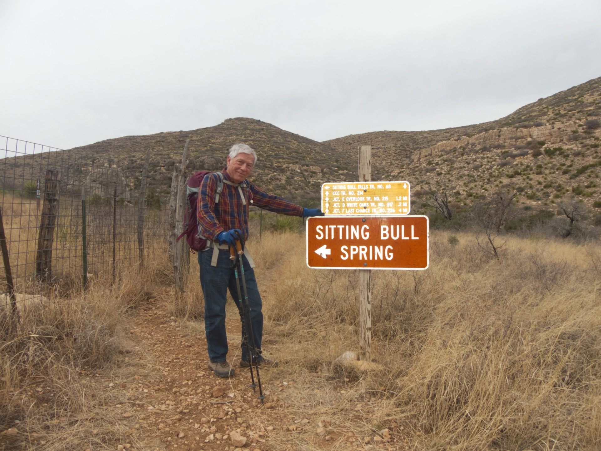Dennis by a trail sign in Sitting Bull Canyon