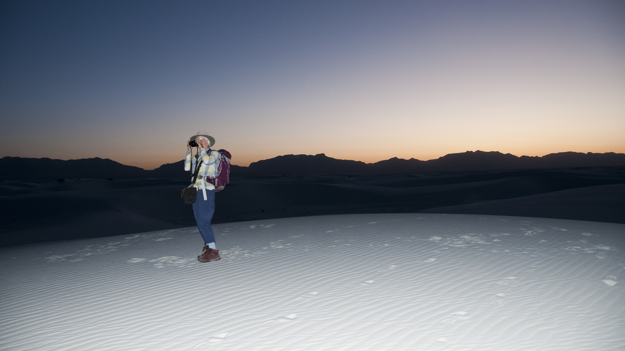 me taking photos with the setting sun behind me