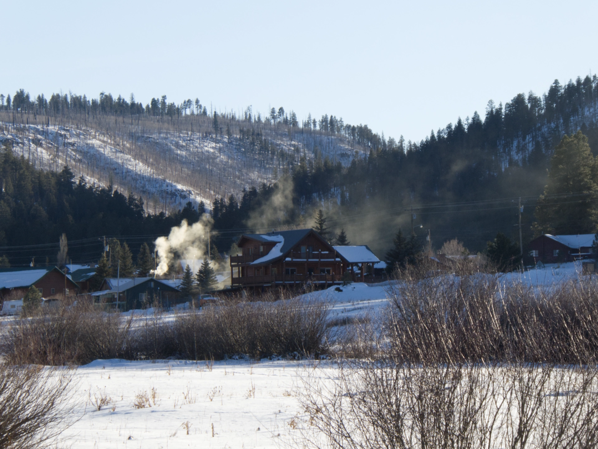 smoke billowing from a chimney in Greer